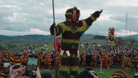 Colorful-folk-Carnival-Parade-around-effigy-in-Podence,-Portugal