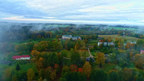 Nature-multicolor-forest-houses-community-aerial-fog-scenary-landscape