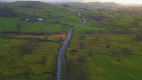 Countryside-Road-On-The-Green-Hilly-Landscape-In-Old-Droomer,-Windermere,-Lake-District,-Cumbria,-England