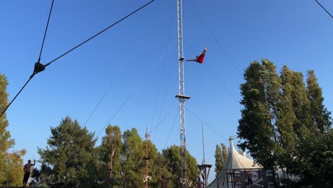 Crazy-diver-dives-in-amusement-park-pool-from-very-high-altitude,-people-clapping-for-dangerous-show