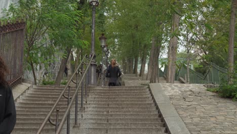 Female-Jogger-Runs-Up-to-Stairs-in-District-of-Montmartre
