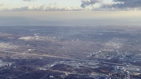 Aerial-view-of-Toronto-suburban-area-as-seen-from-airplane-approaching-airport