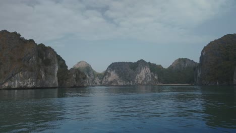 POV-Sailing-Towards-Limestone-Karsts-In-Lan-Ha-Bay-Over-Calm-Sea-Waters,-Vietnam