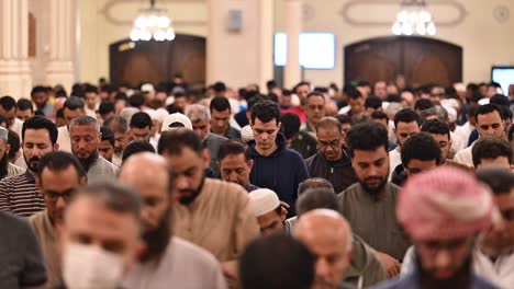 Faithful-performing-Taraweeh-prayer-during-Ramadan-2024-at-a-mosque-in-Sharjah,-United-Arab-Emirates