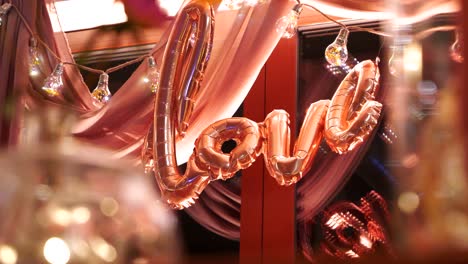 Focus-shift-to-the-"Love"-inscription-made-of-pink-balloons
