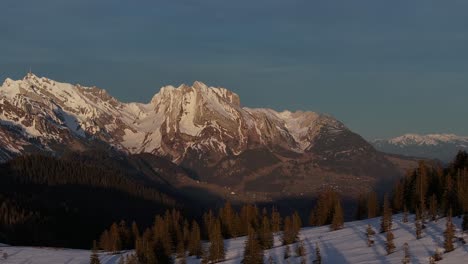 Alpenglow-on-Amden's-majestic-mountain-peaks,-Switzerland---aerial