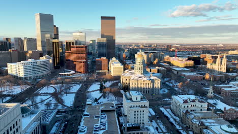 Snowy-winter-drone-view-of-Denver-skyline-and-flight-over-Colorado-State-Capitol