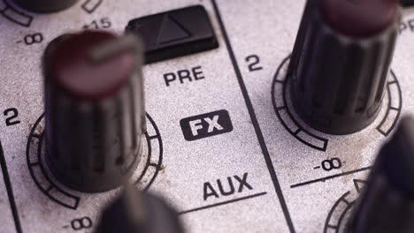 Increasing-FX-Audio-Effects-Gain-on-Mixing-Console,-Macro-Close-Up