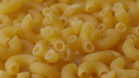 Elbow-Pasta-Macaroni-Falling-On-Surface