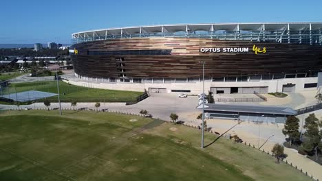Aerial-drone-shot-of-Optus-Stadium-AFL-Football-Stadium-in-Perth,-Western-Australia-by-the-Swan-River