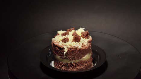 mini-petite-petit-personal-slice-individual-Brownie-and-cheese-cake-delicious-treat-tasty-sweet-in-a-turn-table-black-background