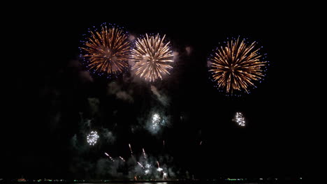 Bursting-colorful-lights-filling-the-dark-skies-of-a-popular-tourist-destination-for-a-pyrotechnics-festival