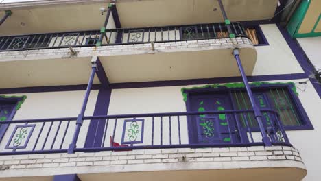 Looking-Up-At-Colourful-Colonial-Style-Balconies-In-Purple-Located-In-Filandia-Colombia