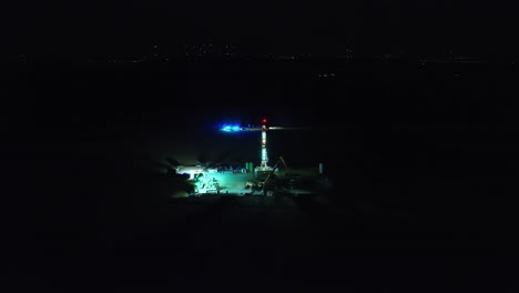 An-Oil-Drilling-Station's-Nighttime-Fire-Department-Operation---Drone-Flying-Forward