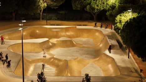 Revealing-evening-time-skatepark-buzzing-with-activity-on-backdrop-of-sunset