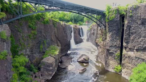 A-spectacular-4K-drone-shot-of-the-historic-Paterson-Great-Falls,-located-in-Paterson,-New-Jersey