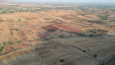 empty-crops-field-near-yamai-temple-in-aundh-wide-to-closeup-drone-view