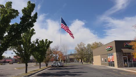 Patriotic-scene:-American-flag-waving-proudly-in-Utah-parking-lot