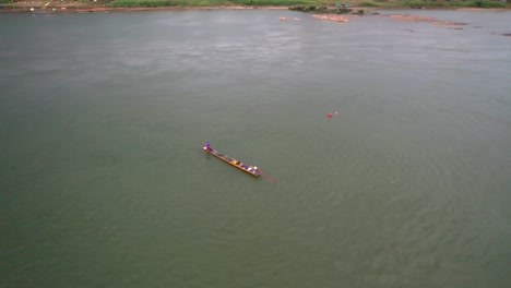 Aerial-shot-of-a-traditional-fisherman-boat-on-the-Mekong-River-in-Chiang-Khan-district-in-Thailand
