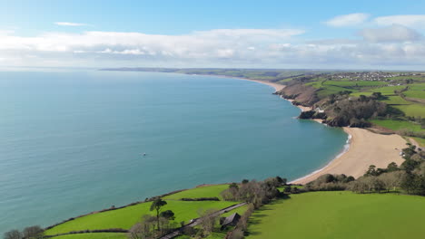 Panoramic-aerial-view-of-Blackpool-Sands-beach-looking-out-over-English-Channel