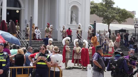 Onlookers-Waiting-for-Crucifixion-Reenactment-to-Being-Behind-Police-Barricade