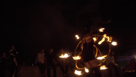 Street-artist-handling-fire-hoops-in-a-night-show