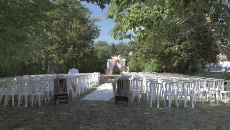 Slow-motion-panning-shot-of-an-exterior-wedding-reception-seating-area