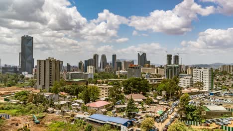 Addis-Ababa,-Ethiopia,-time-lapse-dolly-out,-fast-moving-clouds,-high-angle-view-of-the-city-center