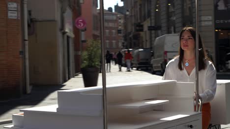 Slow-motion-shot-of-a-small-business-owner-moving-her-stall-through-the-streets