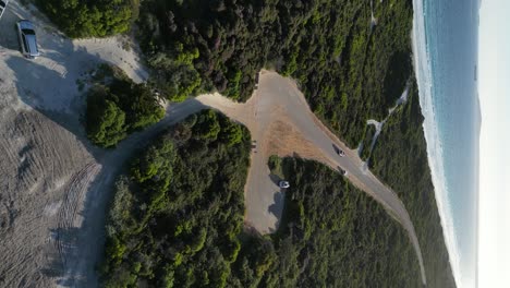 Vehicle-driving-along-panoramic-road-near-Wylie-Bay-Rock-beach,-Esperance-area-in-Western-Australia