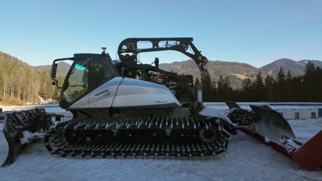 Modern-Parked-Prinoth-Leitwolf-type-of-snow-groomer-from-side-view-in-Planica,-Slovenia