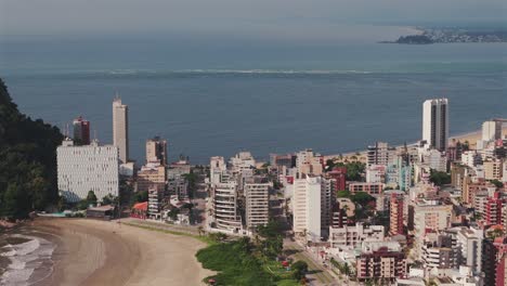 Caiobá-Beach,-nestled-in-Matinhos,-with-Guaratuba-city-in-the-background,-presents-a-captivating-coastal-vista-on-the-Paraná-coast-of-Brazil