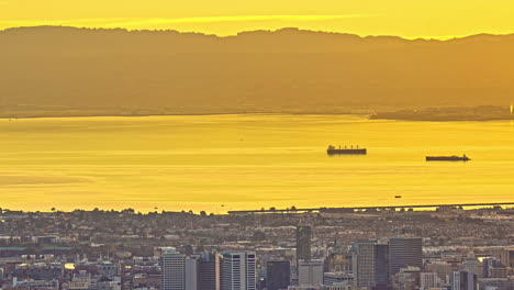 Ferries-travel-in-San-Francisco-bay-on-golden-haze-timelapse