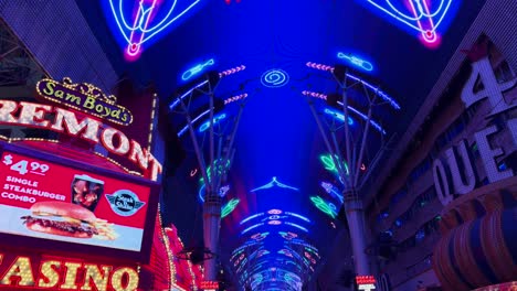 Mesmerizing-neon-lit-walkway-in-the-heart-of-Las-Vegas---tilt-up-camera-shot