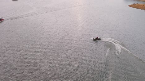 Slow-motion-of-jet-ski-riding-while-circling-leaving-wake-on-water-surface