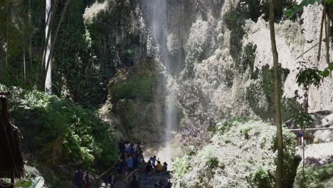 Tourists-sightseeing-the-tumalog-waterfall,-tourist-attraction-Cebu,-Philippines
