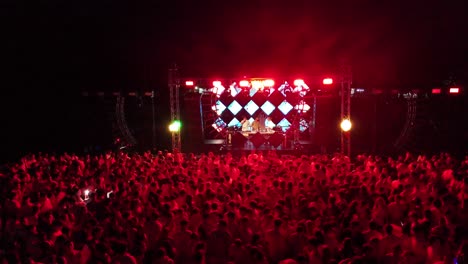 Crowd-of-people-enjoying-an-evening-party-and-DJ-light-show