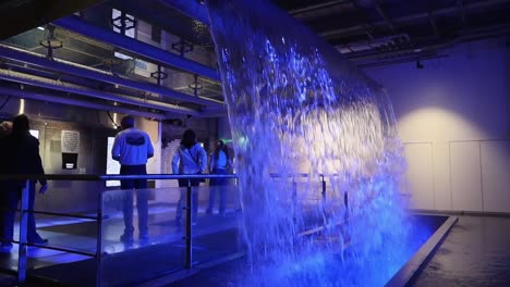 Visitors-exploring-the-Guinness-Storehouse-with-Wicklow-Mountains-water-exhibit