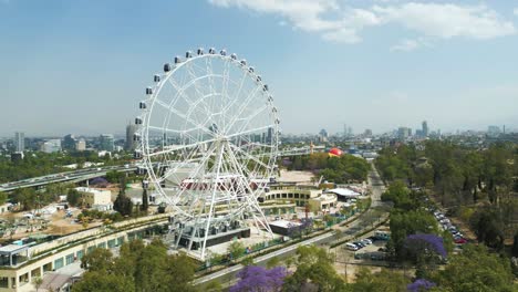 Aerial-view-orbit-Rollercoaster-of-Aztlán-urban-park-landscape-view-of-Chapultepec-and-Mexico-City