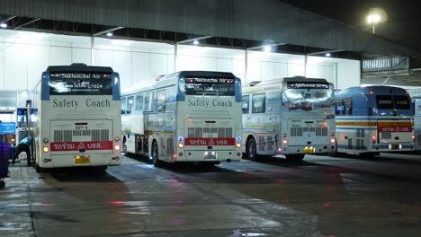 A-row-of-busses-are-parked-at-their-designated-platforms-in-Mochit-Bus-Terminal-for-Northbound-destinations-in-Bangkok,-Thailand