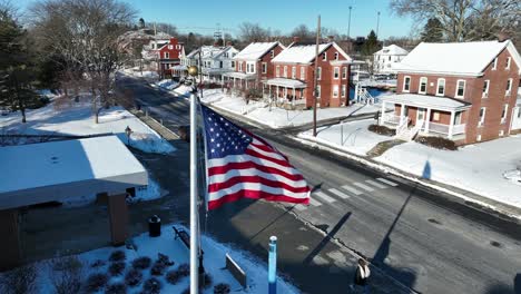 Aerial-establishing-shot-of-an-American-flag-waving