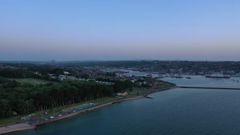 Aerial-shot-of-a-coastal-town-on-the-Isle-of-Wight,-on-a-clear-calm-spring-day