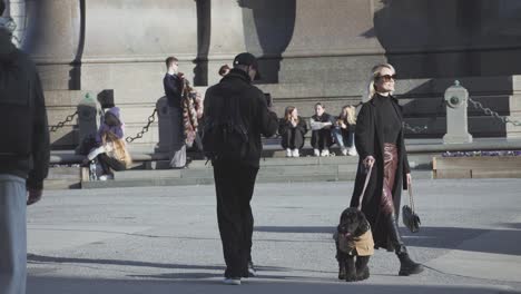 Tourists-Resting-In-Front-Of-Hofburg-Former-Principal-Imperial-Palace,-Vienna,-Austria