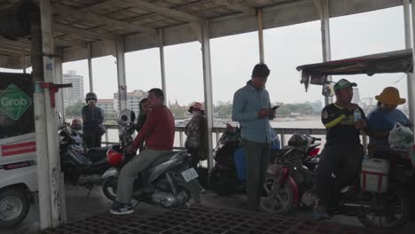 Someone-transfers-by-a-transport-ship-driving-on-Mekong-River-at-Phnom-Penh-Areiy-Ksatr-port