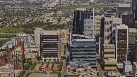 Calgary-AB-Canada-Aerial-v42-zoom-drone-tracking-shot-capturing-cityscape-across-Eau-Claire,-Downtown-Commercial-and-Beltline-districts-with-a-mix-developments---Shot-with-Mavic-3-Pro-Cine---July-2023