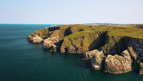 Aerial-Shot-of-Cinematic-Cliffs-of-St-Abbs:-A-Scottish-Borders-Coastal-Symphony,-Scotland,-United-Kingdom