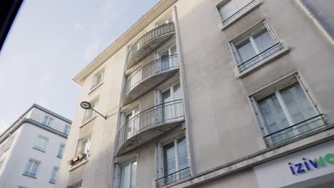 Soft-moving-shot-from-car-of-buildings-in-streets-of-city-in-France