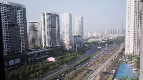 Aerial-View-Of-Ho-Chi-Minh-Cityscape-With-High-Rise-Buildings-And-Road-Traffic-In-Vietnam