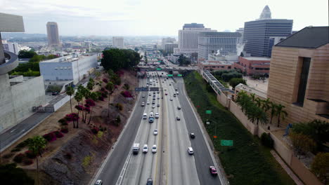 Los-Angeles-USA,-Aerial-View-of-US-101-Highway-Traffic-Along-Downtown-Buildings,-Hollywood-Freeway