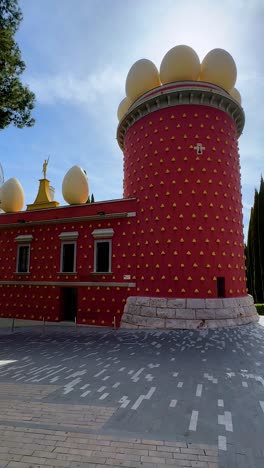 vertical-video-Figueras-Dalí-museum-facade-of-egg-building,-Costa-Brava,-Gerona